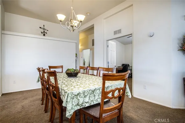 a kitchen with refrigerator sink and cabinets