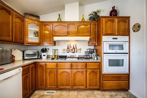 a kitchen with a sink cabinets and window
