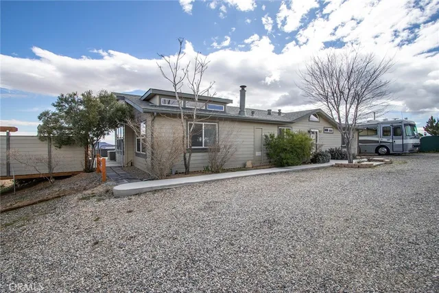 a view of a house with a yard and garage