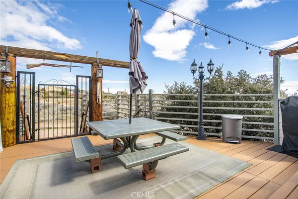 a view of a backyard with sitting area
