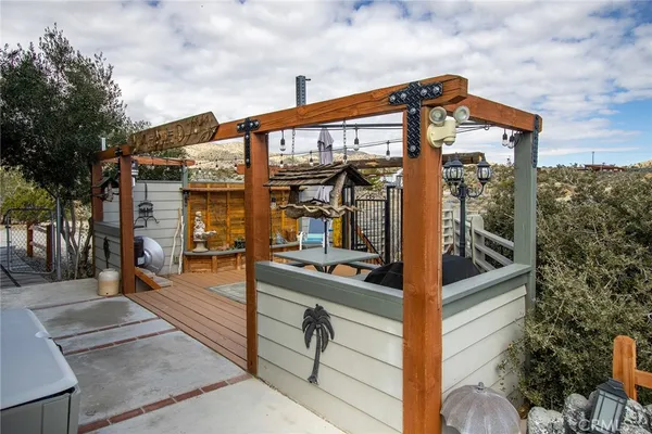 a view of an chairs and table in the patio