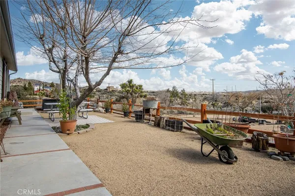 a view of a house with a snow in the yard
