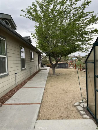 a kitchen with stainless steel appliances granite countertop a refrigerator a stove a sink and a microwave