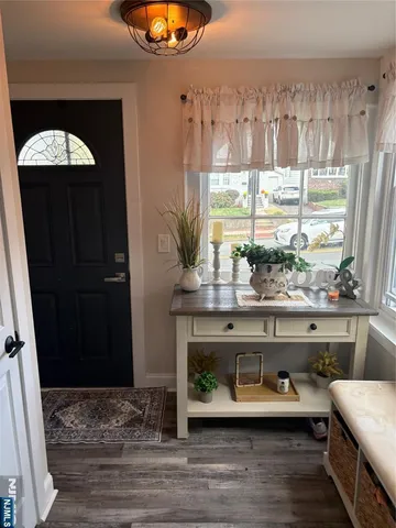 a view of entryway with wooden floor