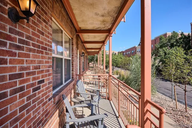 a view of a balcony with wooden floor