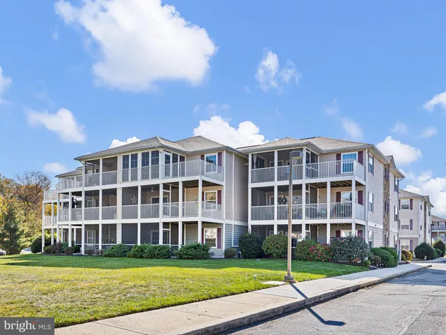 a view of a building with a yard