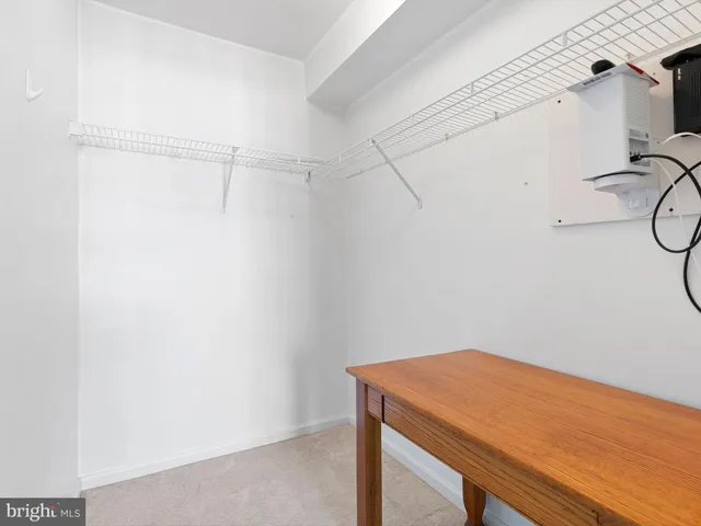 a view of an empty room with a fireplace