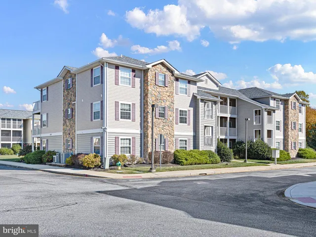 a city street lined with buildings and a street