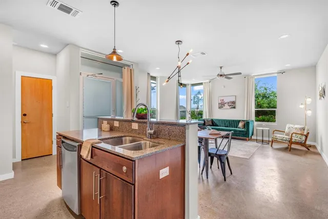 a kitchen that has a lot of cabinets in it