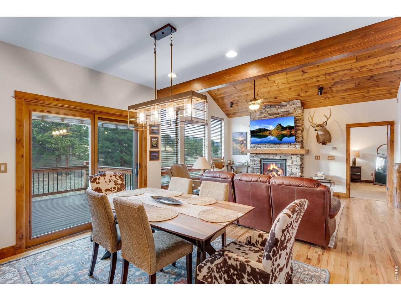 1127 Fish Creek Road Estes Park, CO 80517 - Photo 19 of 50 Access to the deck from the dining room.