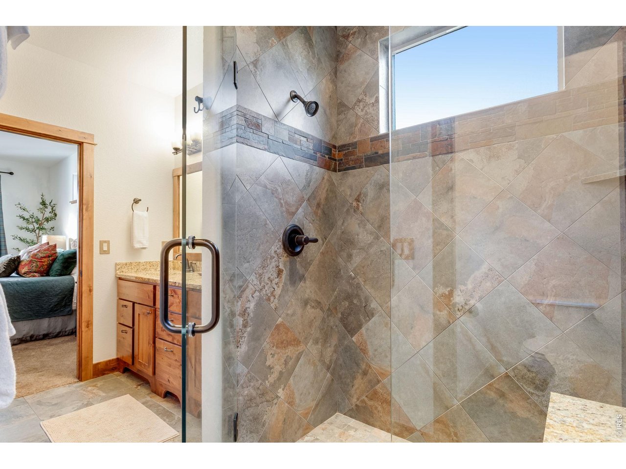 1127 Fish Creek Road Estes Park, CO 80517 - Photo 29 of 50 Beautiful tile shower in primary bath.