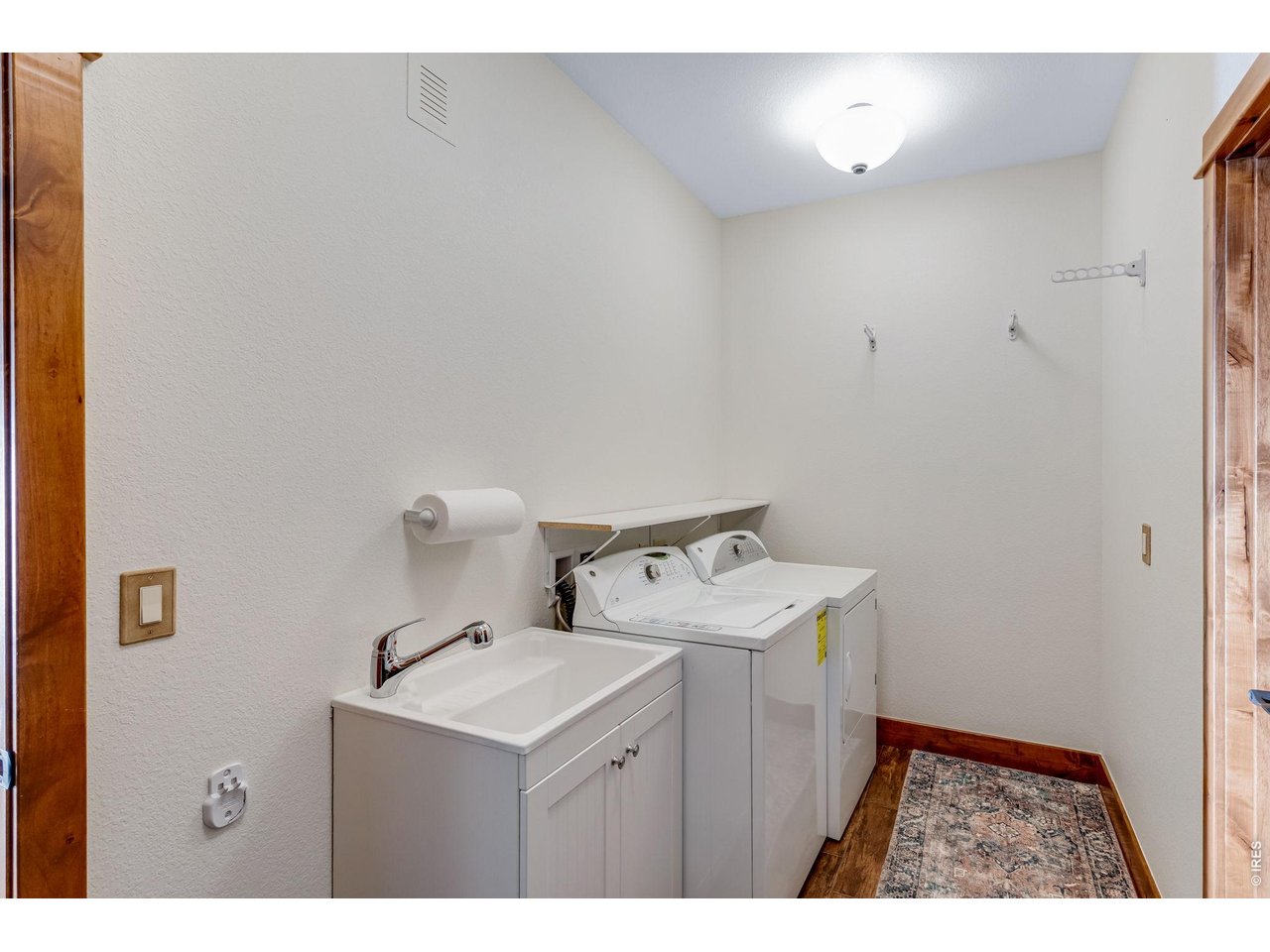 1127 Fish Creek Road Estes Park, CO 80517 - Photo 41 of 50 Downstairs laundry room with sink and additional storage