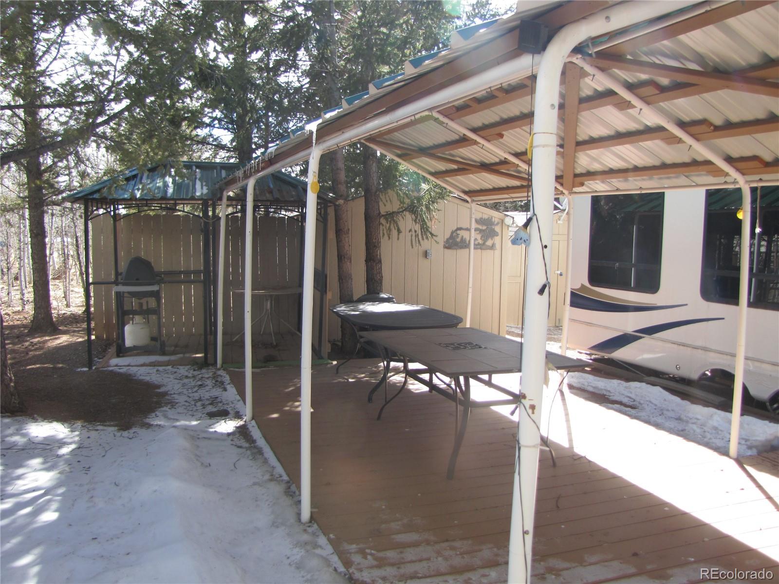 540 Lantern Loop Fairplay, CO 80440 - Photo 12 of 24 a view of a porch with furniture and a yard