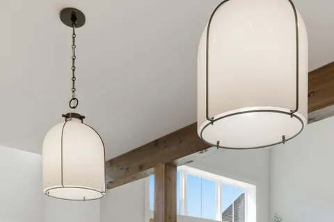 a room with a mirror and a chandelier