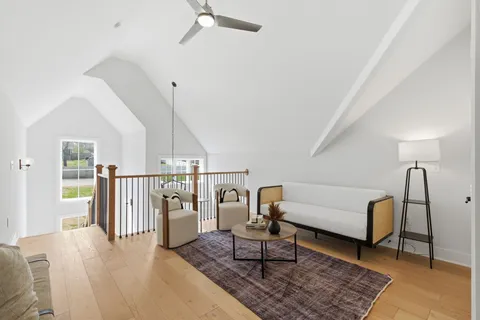 a living room with furniture and a rug