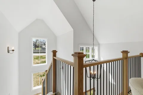 a view of a hallway with windows