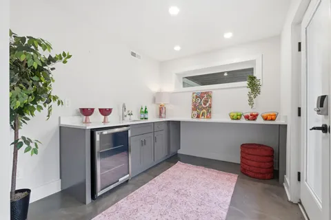 a view of a dinning table and chairs in patio of the house