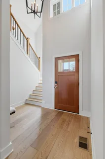 a view of an entryway with wooden floor