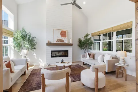 a living room with furniture and a fireplace