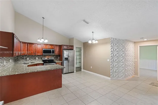a view of a lake with houses in the background