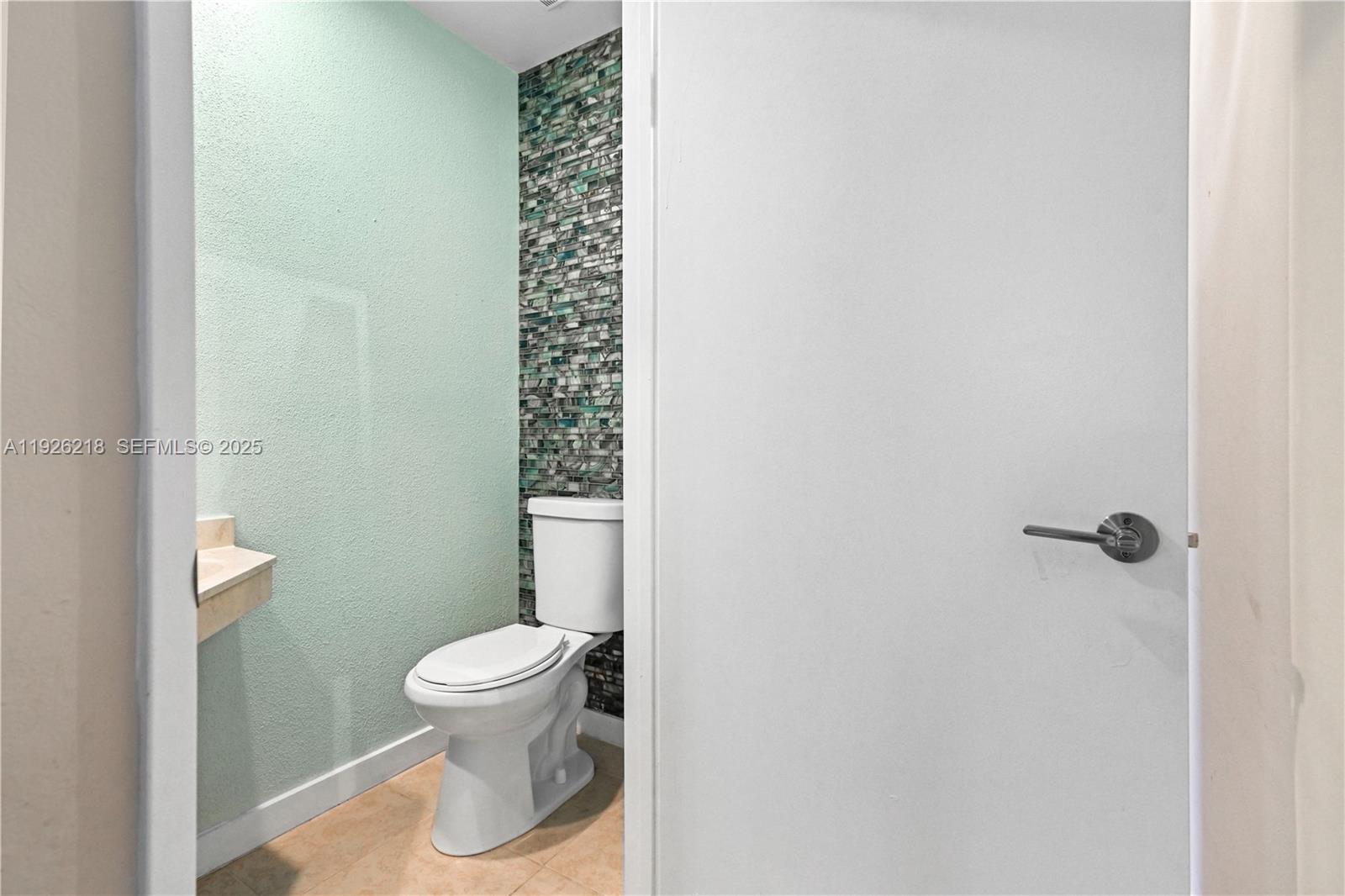 9568 Boca Gardens Parkway, Unit B Boca Raton, FL 33496 - Photo 25 of 71 a bathroom with a toilet and a shower