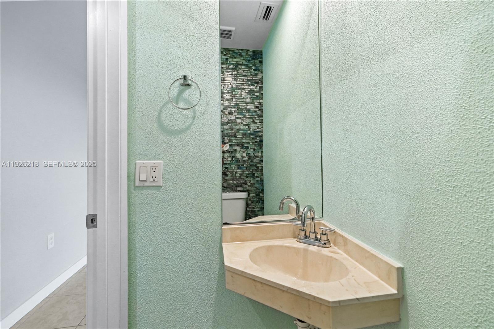 9568 Boca Gardens Parkway, Unit B Boca Raton, FL 33496 - Photo 26 of 71 a bathroom with a sink and a mirror