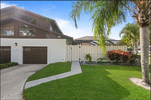 a large kitchen with stainless steel appliances a counter top space cabinets and stainless steel appliances