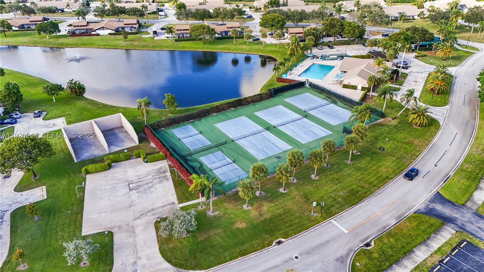9568 Boca Gardens Parkway, Unit B Boca Raton, FL 33496 - Photo 53 of 71 an aerial view of a house with a garden and lake view