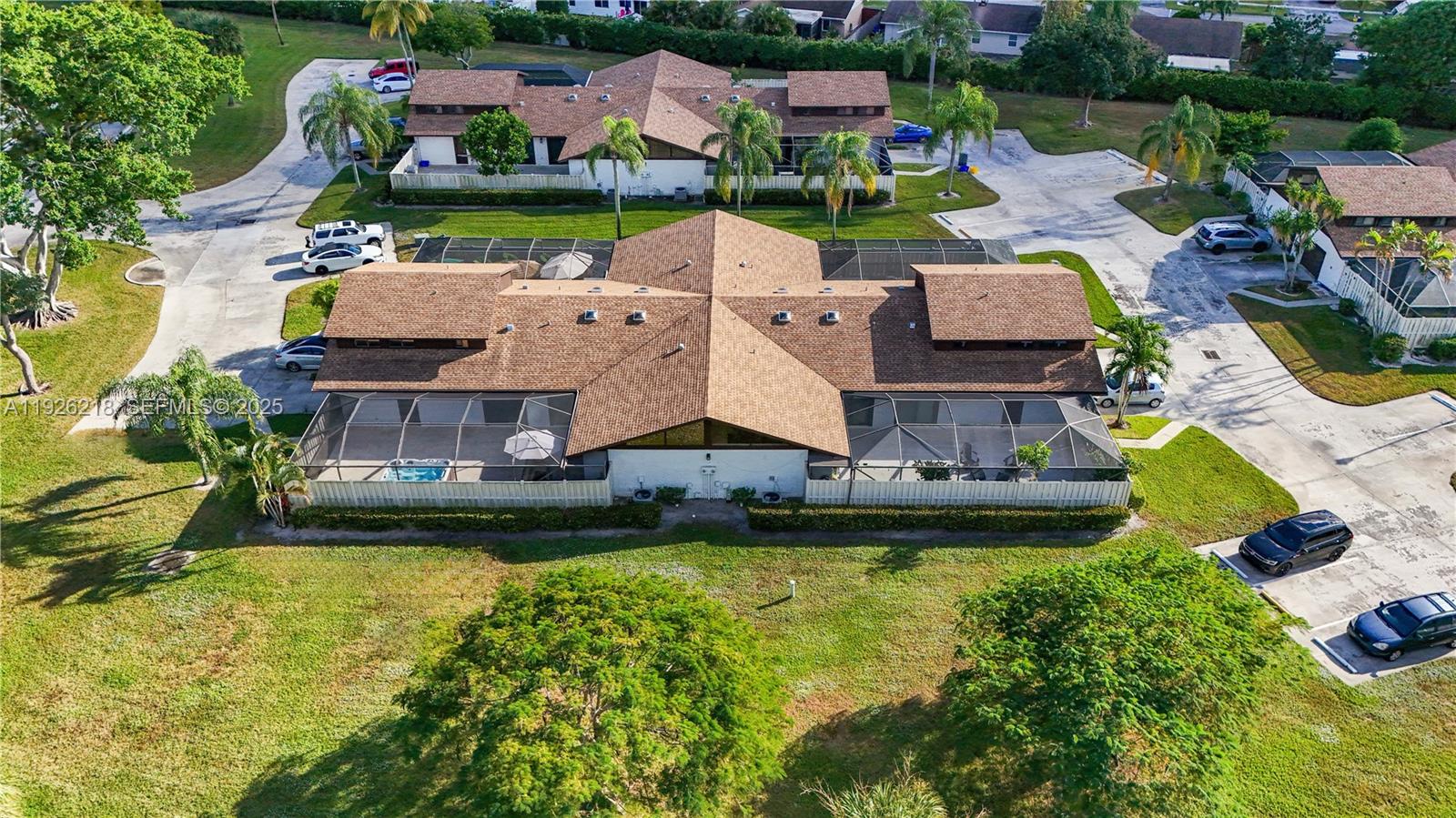 9568 Boca Gardens Parkway, Unit B Boca Raton, FL 33496 - Photo 58 of 71 a aerial view of a house with swimming pool a yard and outdoor seating