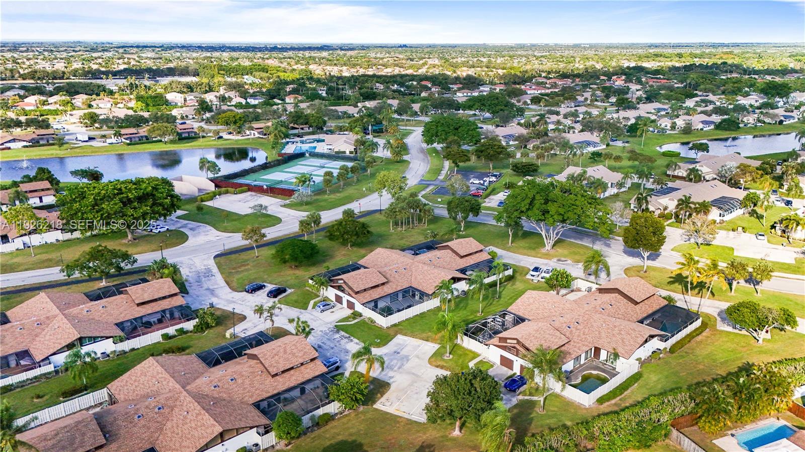 9568 Boca Gardens Parkway, Unit B Boca Raton, FL 33496 - Photo 68 of 71 an aerial view of residential houses with outdoor space