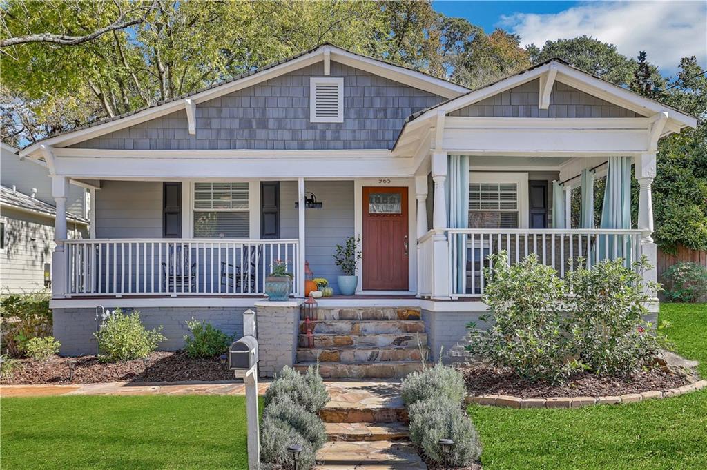 965 Rice Street Northwest Atlanta, GA 30318 - Photo 1 of 1 front view of a house with a yard