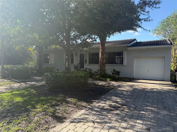 a front view of a house with yard