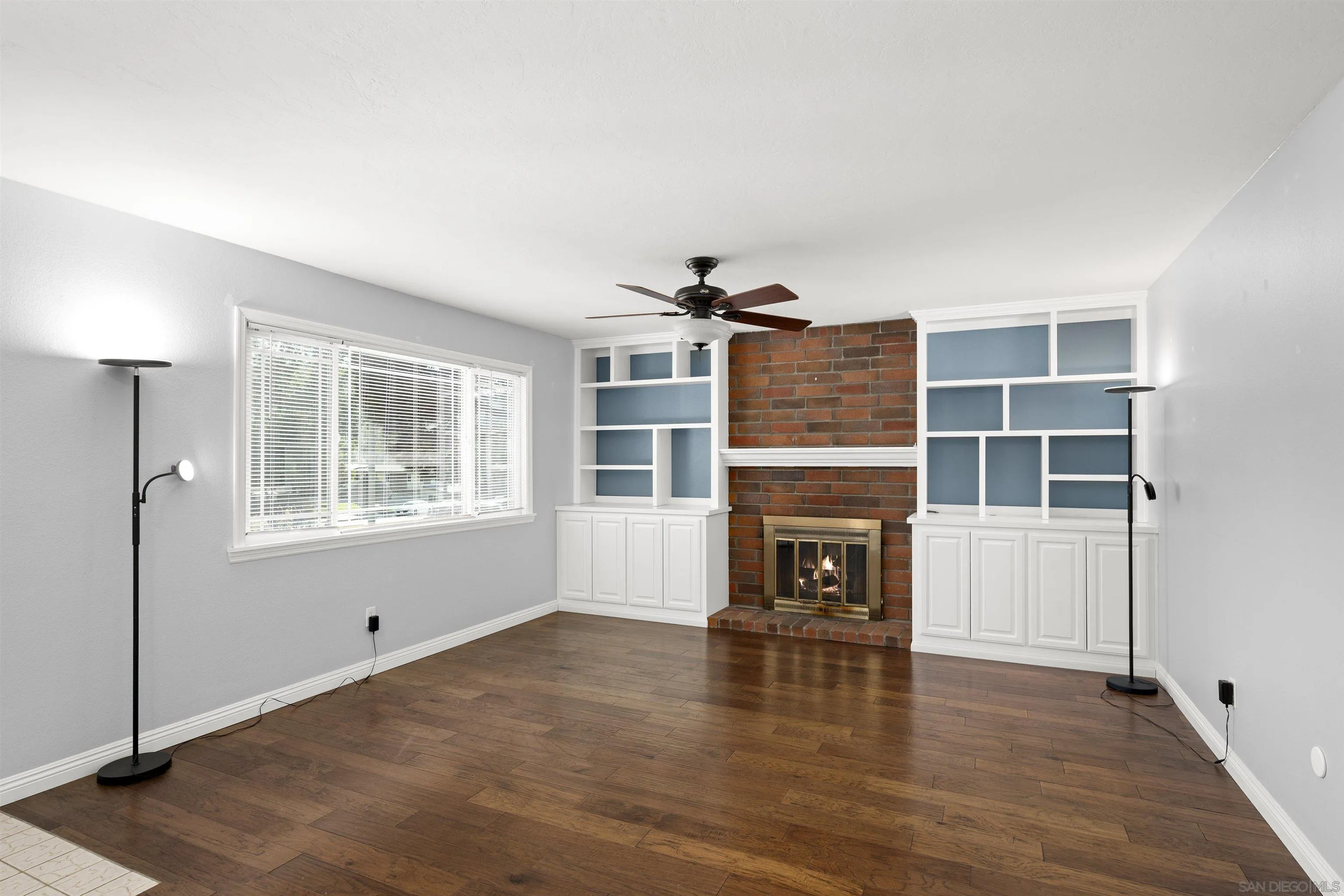 12679 Ridgeton Drive Lakeside, CA 92040 - Photo 7 of 33 a view of an empty room with a window and fireplace