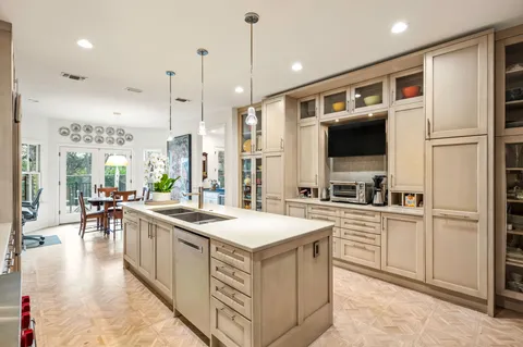 a kitchen with a sink stove and refrigerator