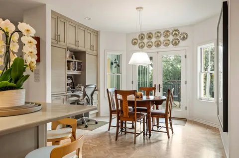 a view of a dining room with furniture window and outside view