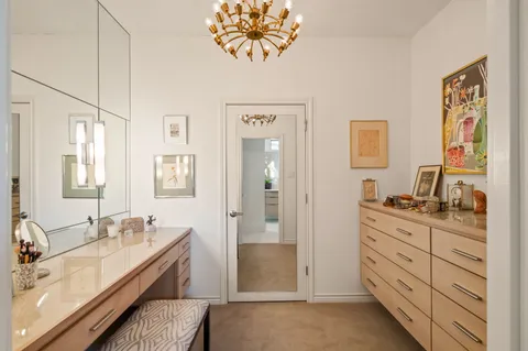 a bathroom with a granite countertop sink mirror and a