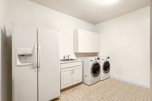 311 Ridgewood Road Austin, TX 78746 - Photo 26 of 38 a utility room with dryer and washer