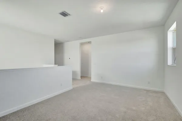 an empty room with closet area