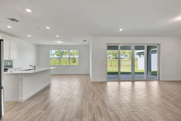 a kitchen with stainless steel appliances a stove a sink and a microwave