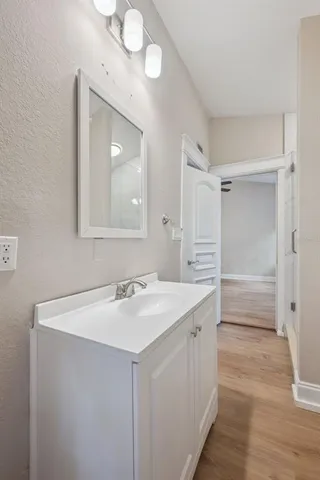a bathroom with a sink a mirror and a shower