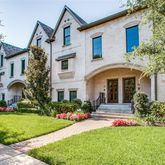 a front view of a house with garden and porch