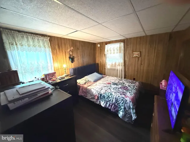 a bathroom with a sink toilet and window