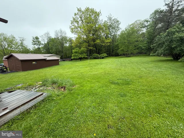 a view of a backyard with a garden