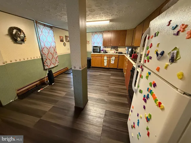 a view of a livingroom with wooden floor