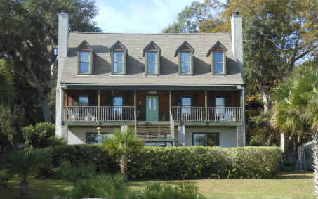 97030 Pirates Point Road Yulee, FL 32097 - Photo 1 of 24 a front view of residential houses with yard and green space