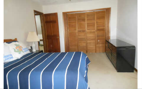 97030 Pirates Point Road Yulee, FL 32097 - Photo 15 of 24 a bedroom with a bed and a window