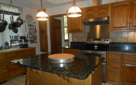 97030 Pirates Point Road Yulee, FL 32097 - Photo 3 of 24 a bathroom with a sink a mirror and shower