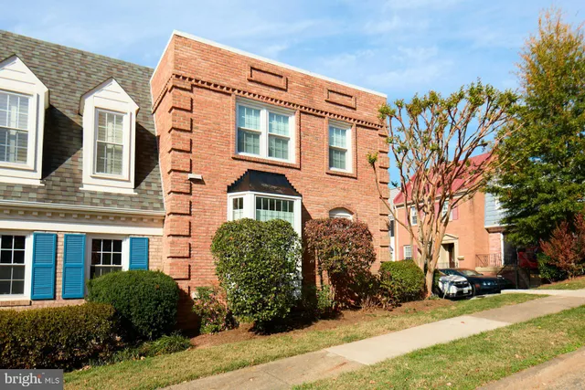 a view of a building with a yard