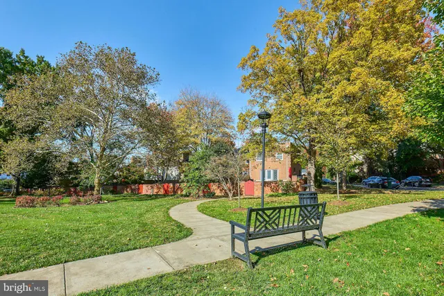 a view of outdoor space with playground and green space