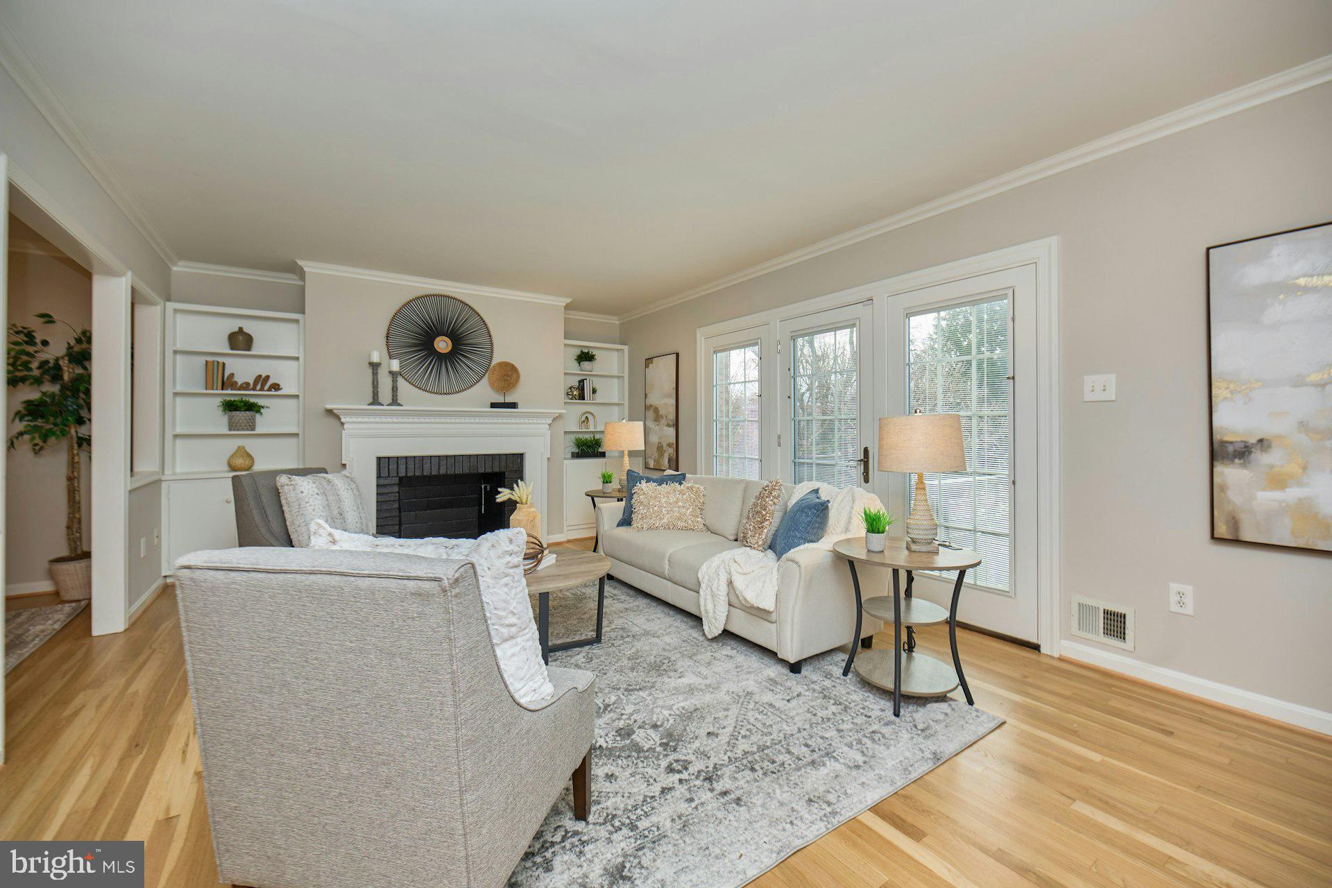 1120 Kensington Road McLean, VA 22101 - Photo 13 of 47 a living room with furniture a rug and a fireplace